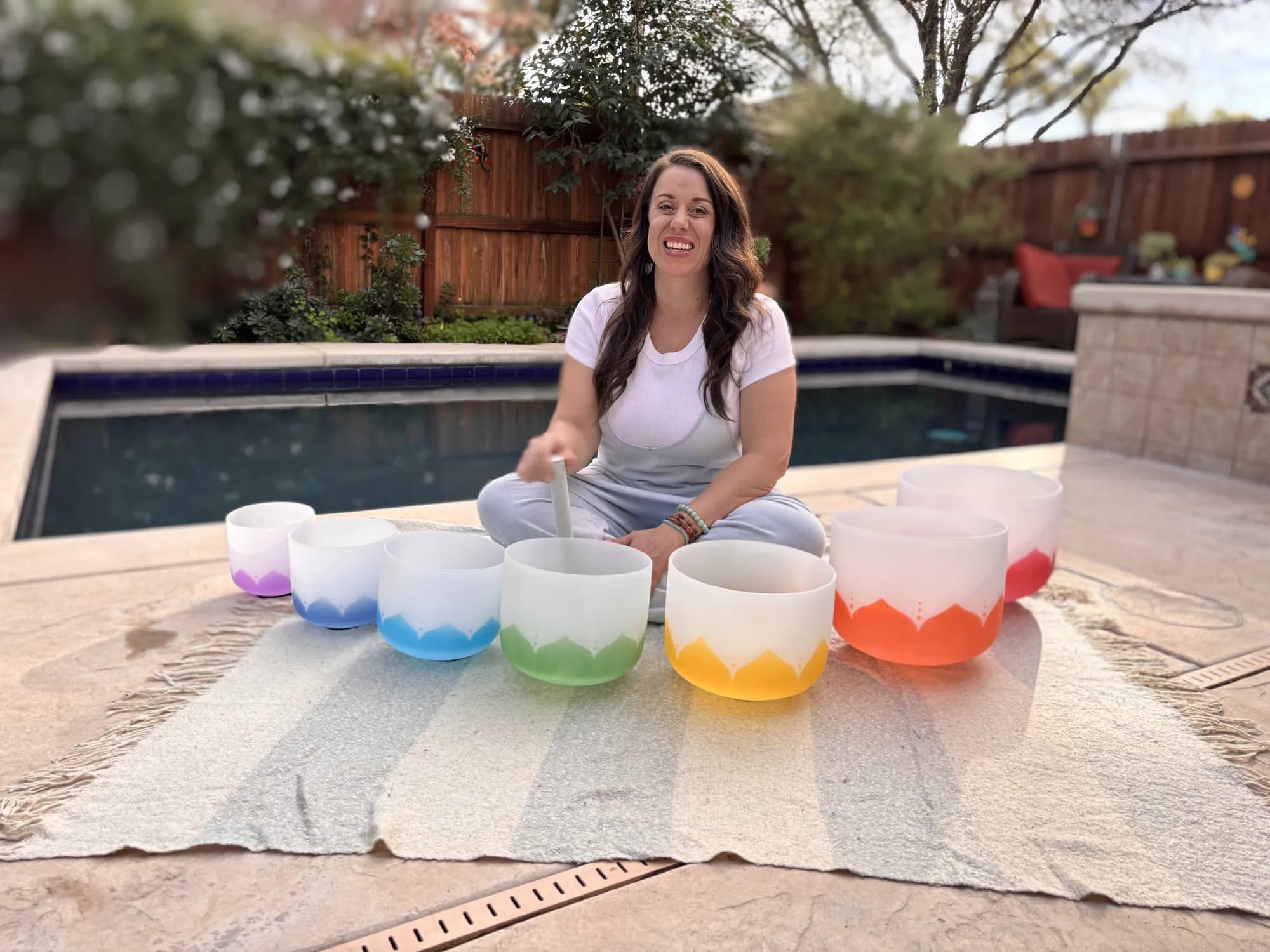 Seven crystal singing bowls arranged for a sound bath session